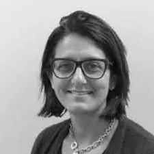 Black and white head and shoulders photo of DAUK chair Ms Helen Fernandes. is concerned and upset for the hundreds of doctors who have received incorrect exam results