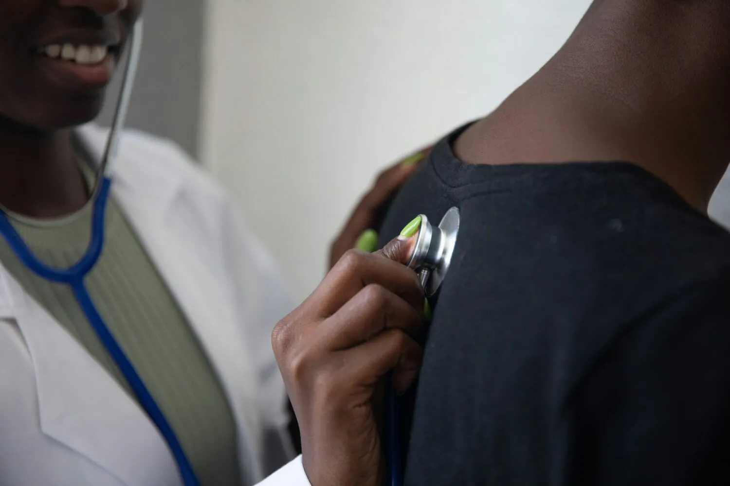 Image of a GP using a stethoscope. Members of our GP committee have written an editorial on the uncertain future of GP partnerships in England