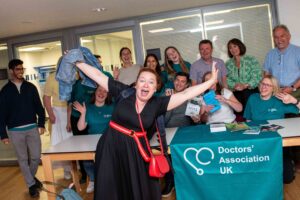 Keynote speaker Dr Rachel Clarke photobombs a group photo at the end of the DAUK conference