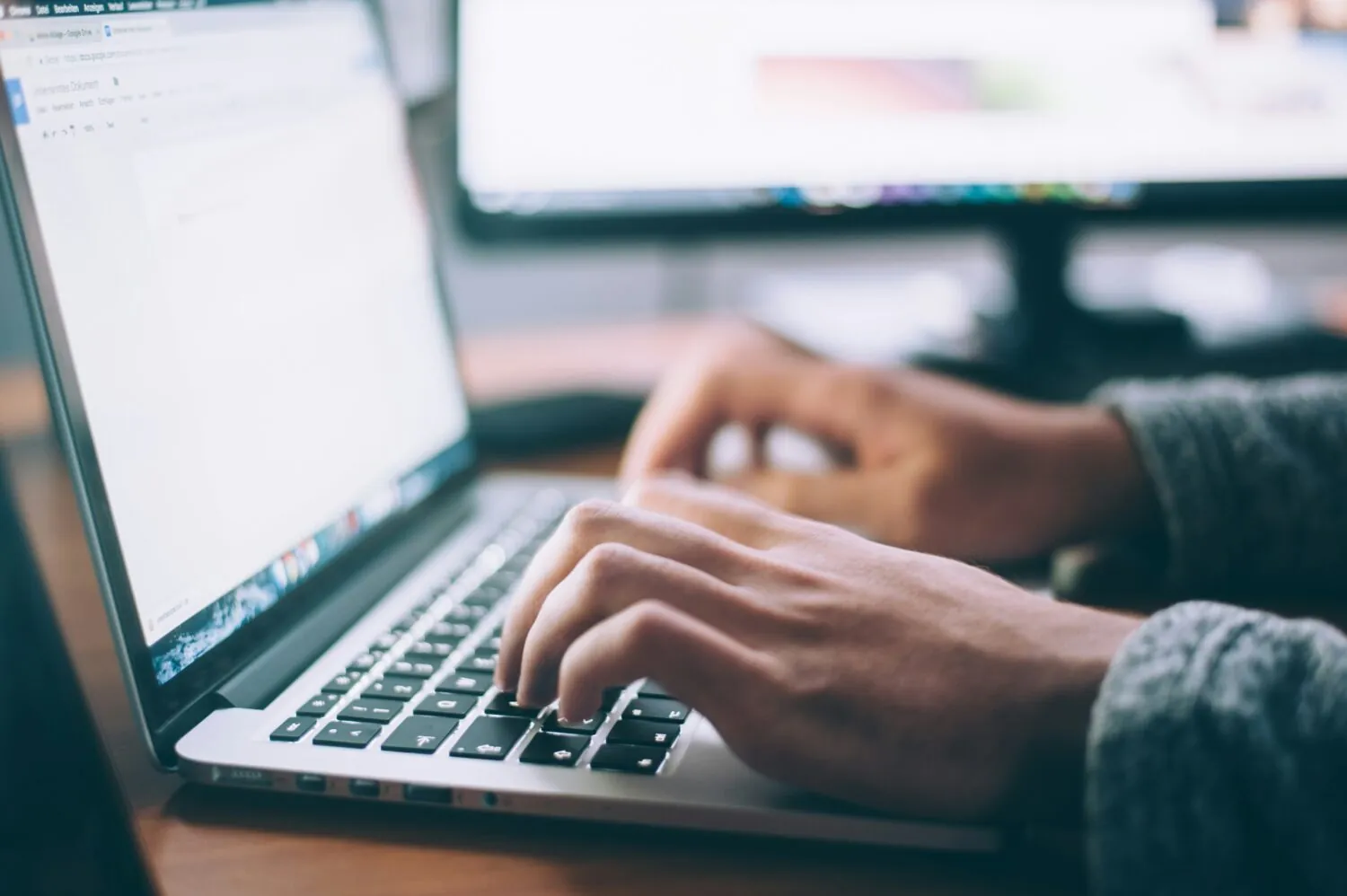Someone typing on a laptop. Doctors for the NHS is asking for entries to its Peter Fisher Essay Prize 2025