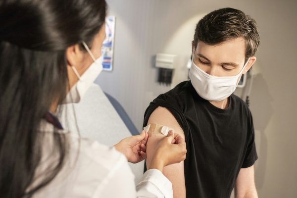 Stock image of a patient receiving a vaccination