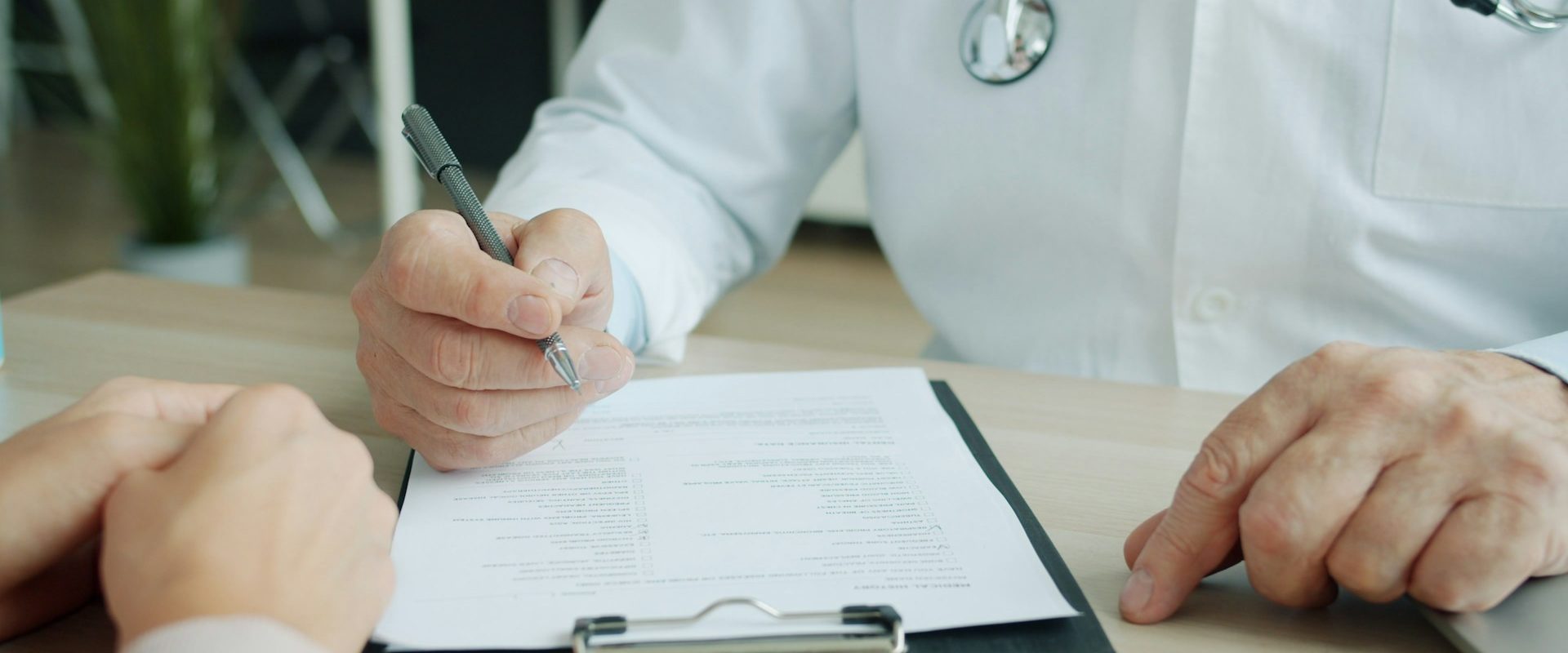 Stock image of a doctor talking to a patient