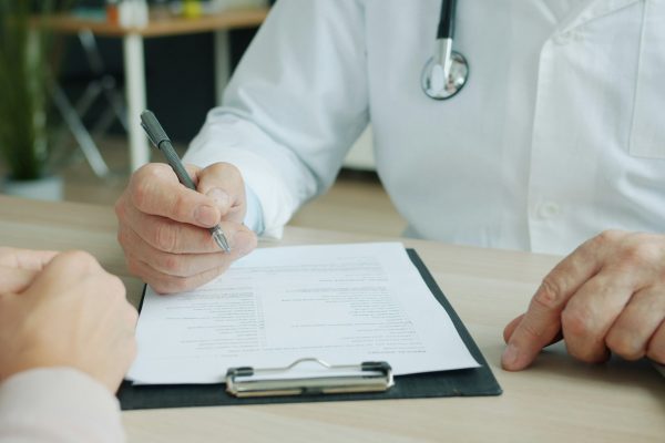 Stock image of a doctor talking to a patient