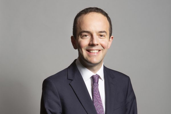 Official portrait photo of health secretary James Murray